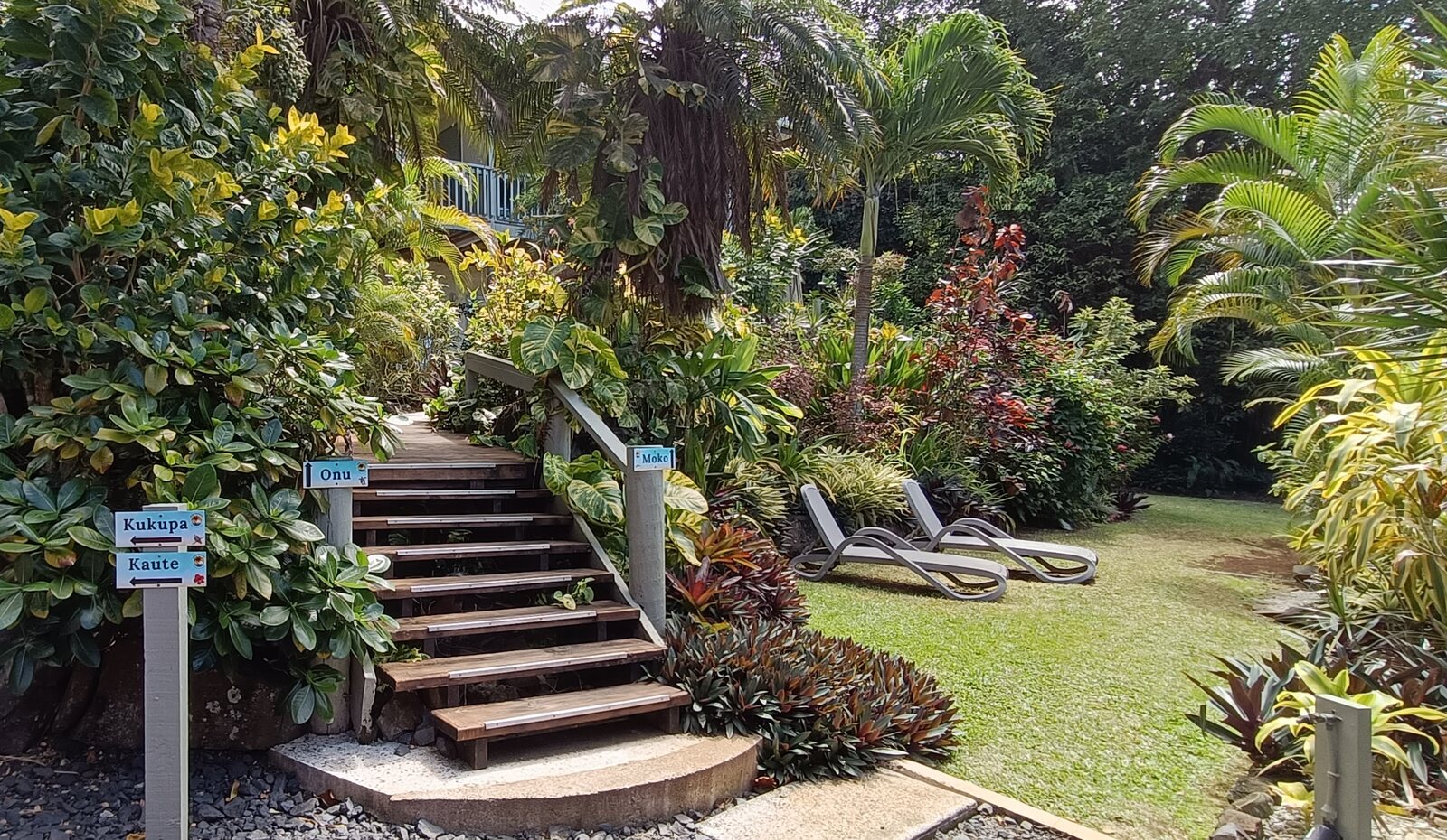 Garden steps with signs to the apartments