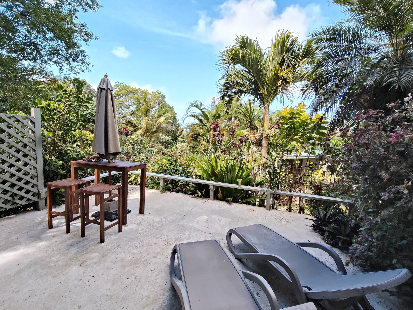 Kaute outdoor dining table overlooking tropical gardens
