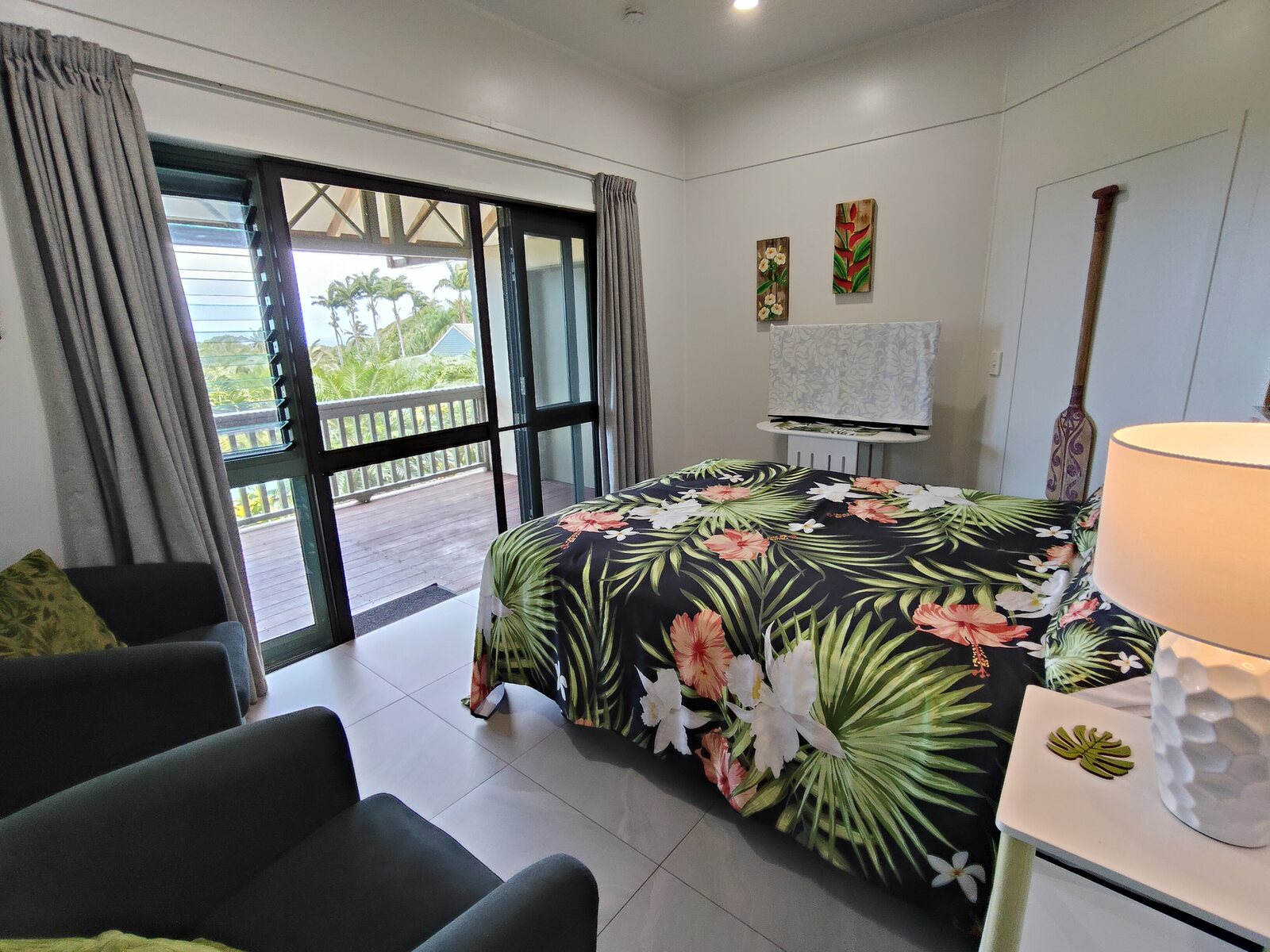 Kukupa queen bedroom opening onto the private veranda