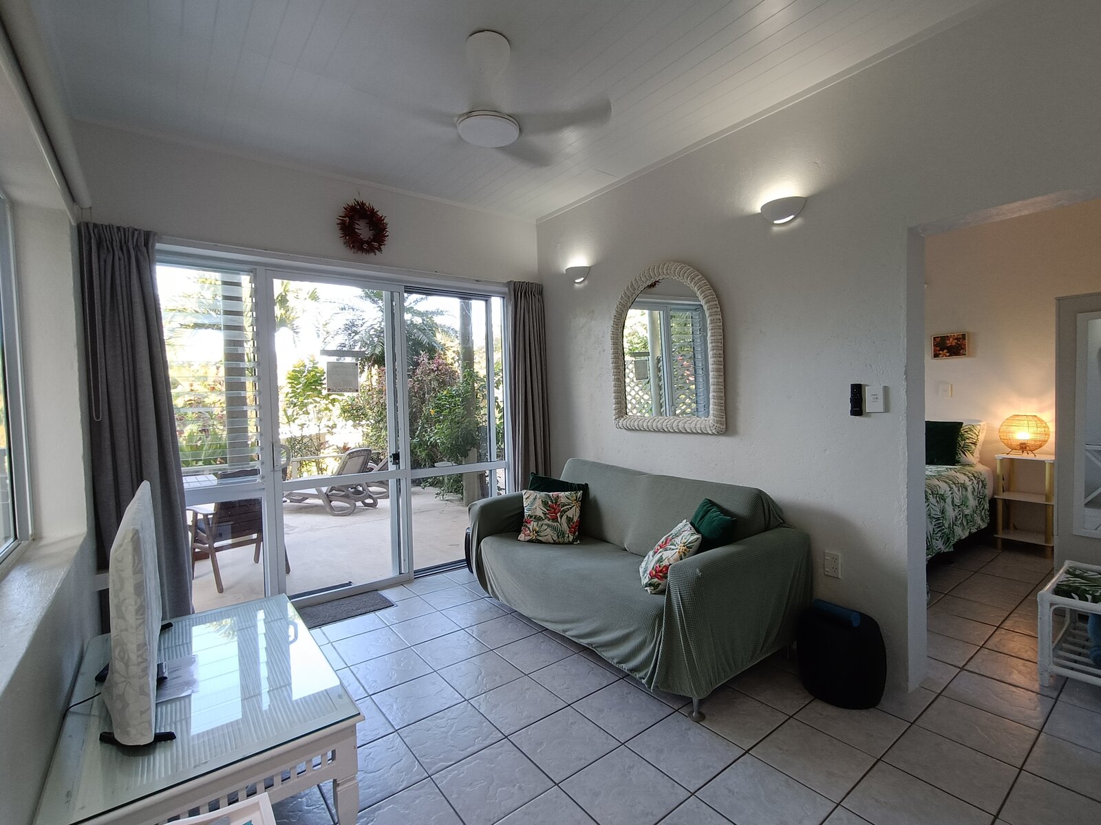 Bright Moko lounge with patio and garden views