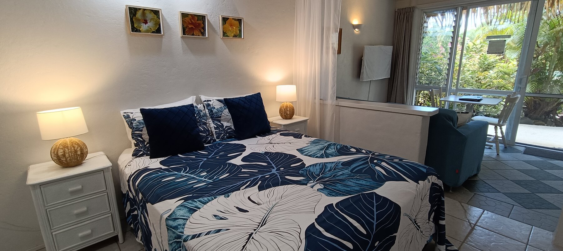 Onu queen bedroom opening onto the tropical garden deck